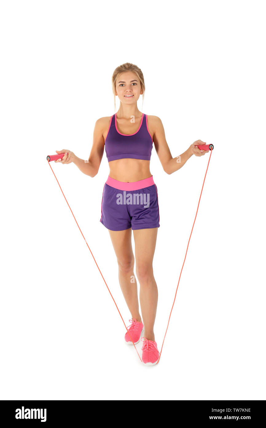 Sporty young woman with jumping rope on white background Stock Photo ...