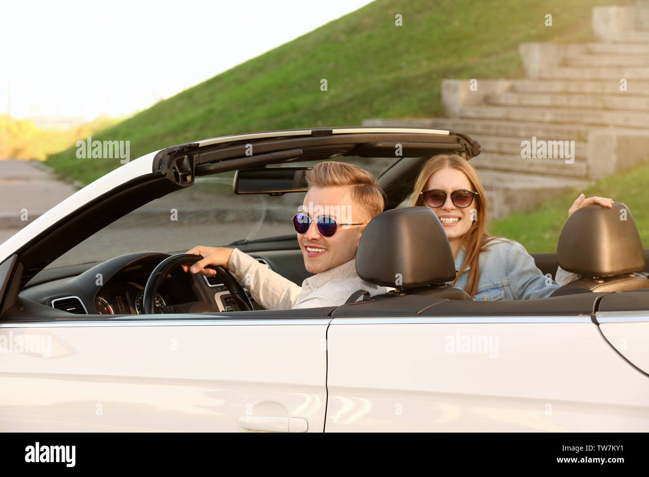 Young couple in car on road hi-res stock photography and images - Alamy