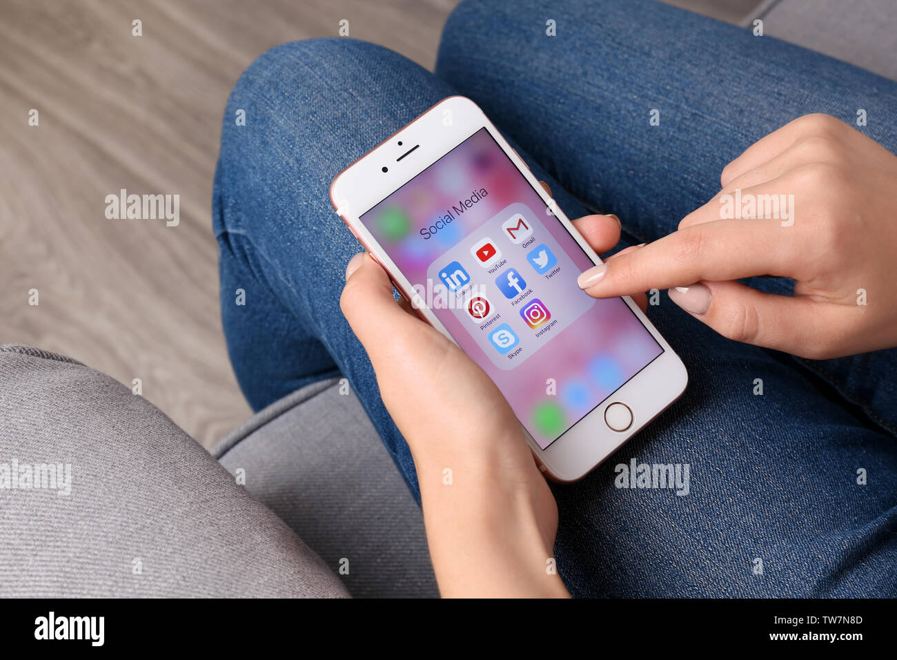 KIEV, UKRAINE - OCTOBER 02, 2017: Woman holding rose gold iPhone 6S with social media icons on screen Stock Photo