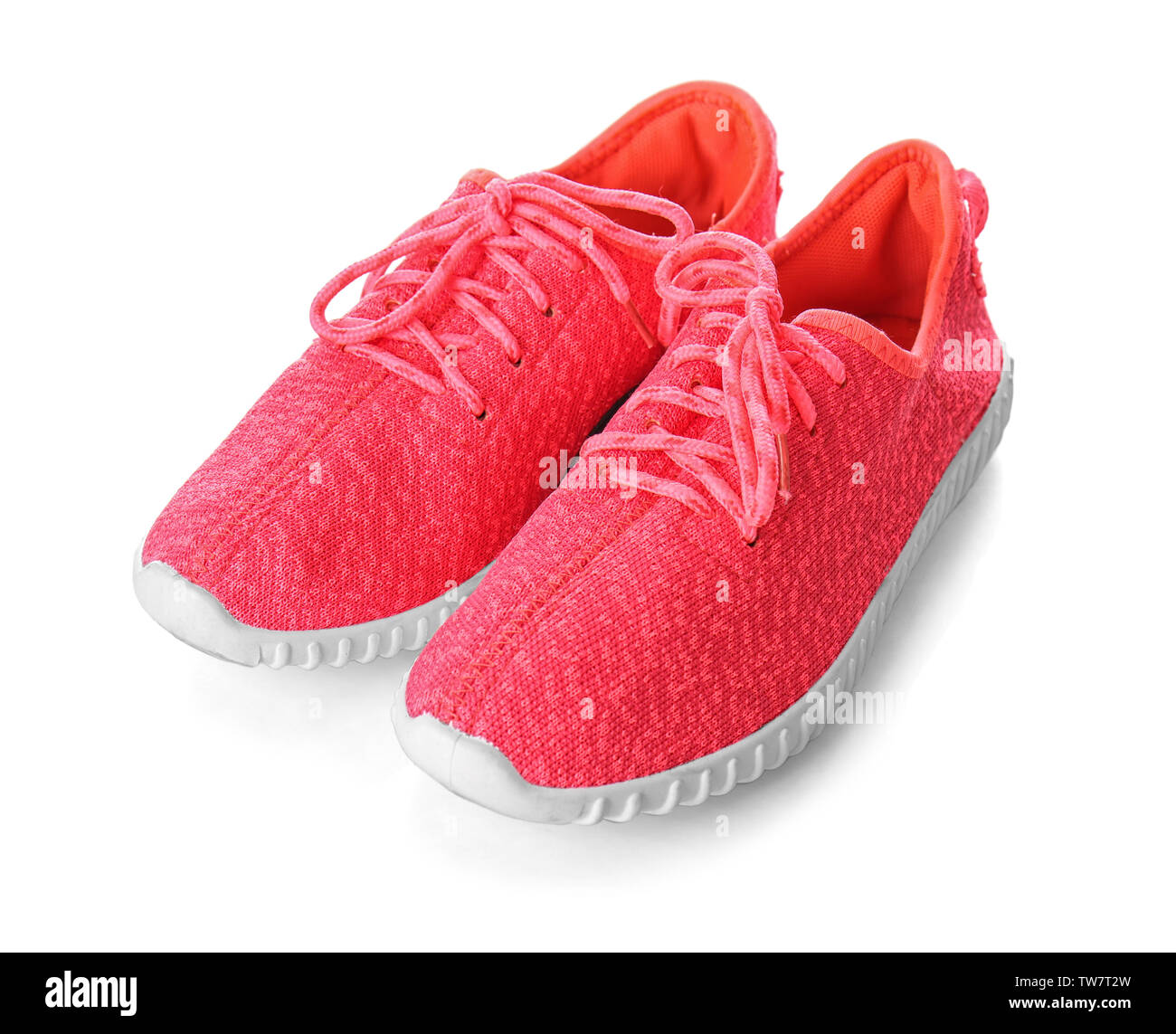 Pair of female sport shoes on white background Stock Photo