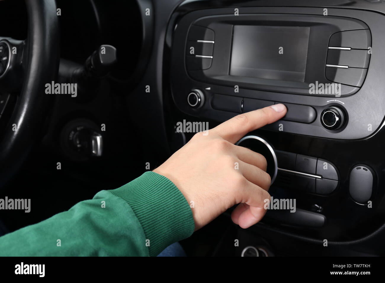 Man tuning radio in car Stock Photo Alamy