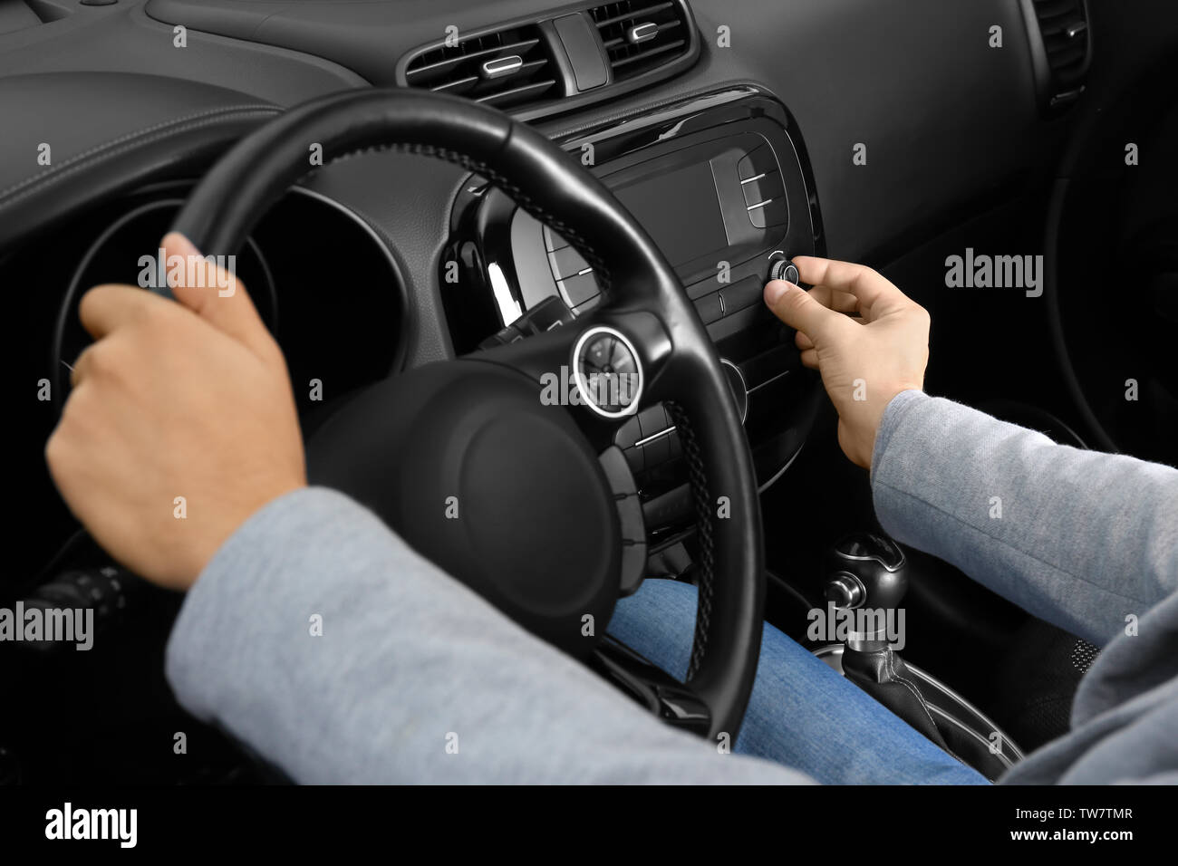 Man tuning radio in car Stock Photo Alamy