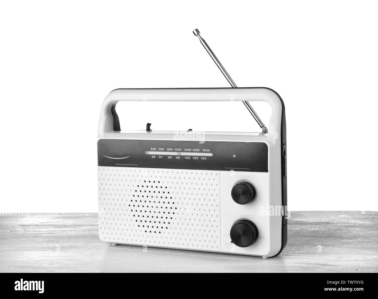 Retro radio on table against white background Stock Photo