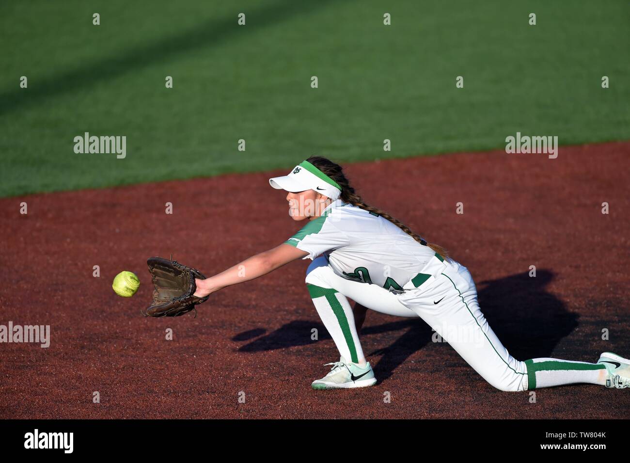 Second baseman stretching to catch a throw to record a force play at second base. USA. Stock Photo