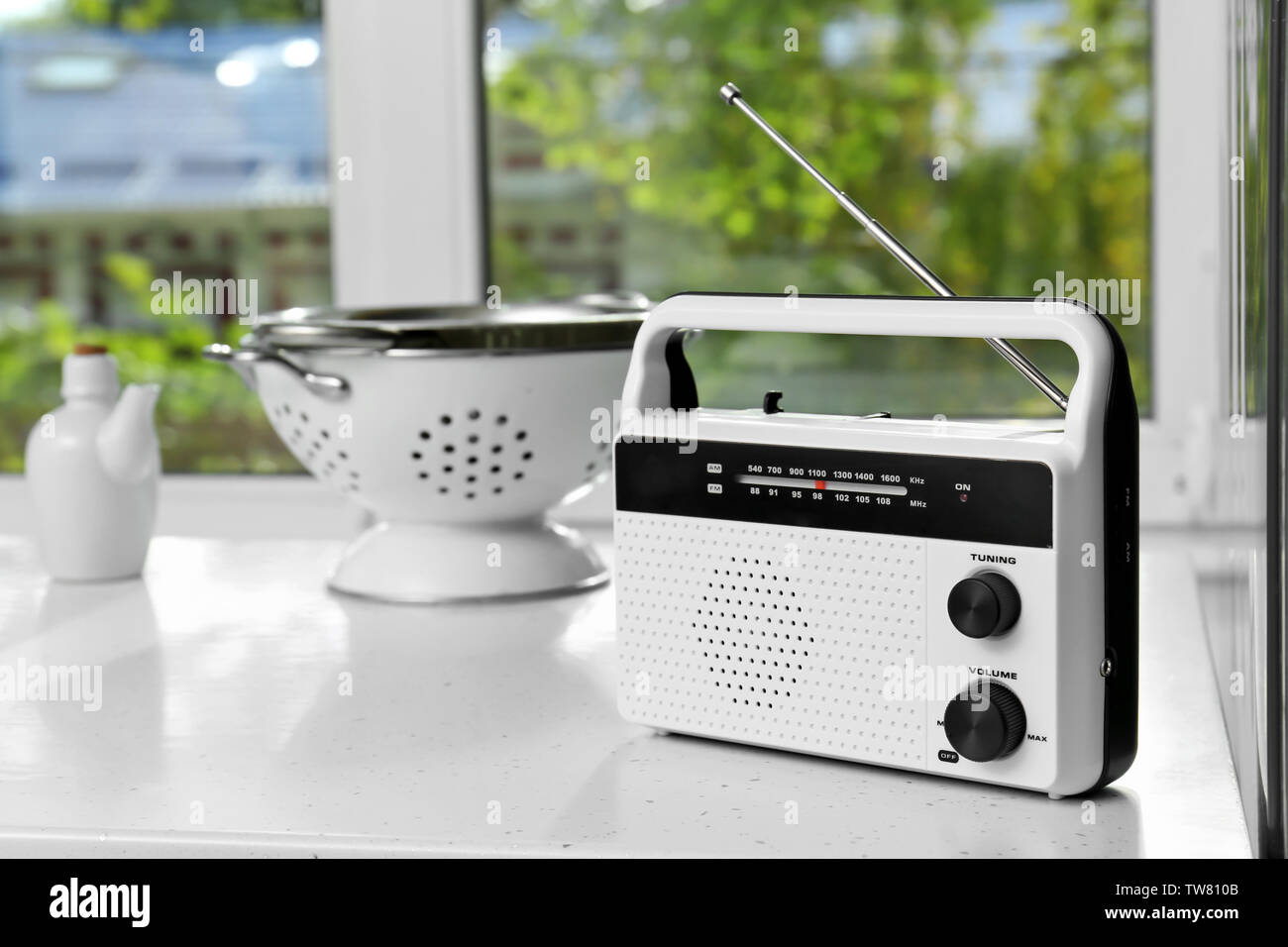 Modern radio on table in kitchen Stock Photo - Alamy