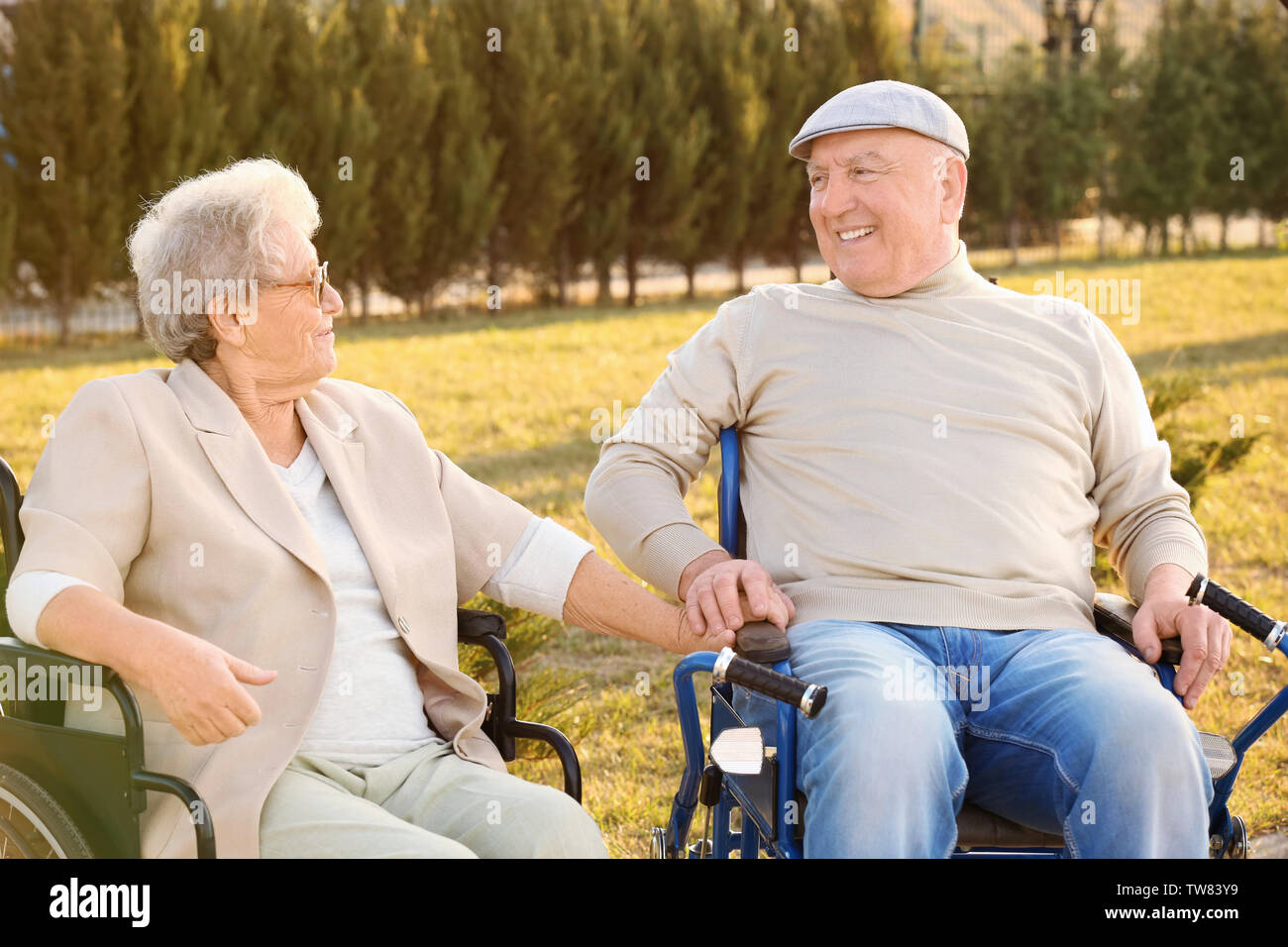Senior man and woman from care home in park Stock Photo