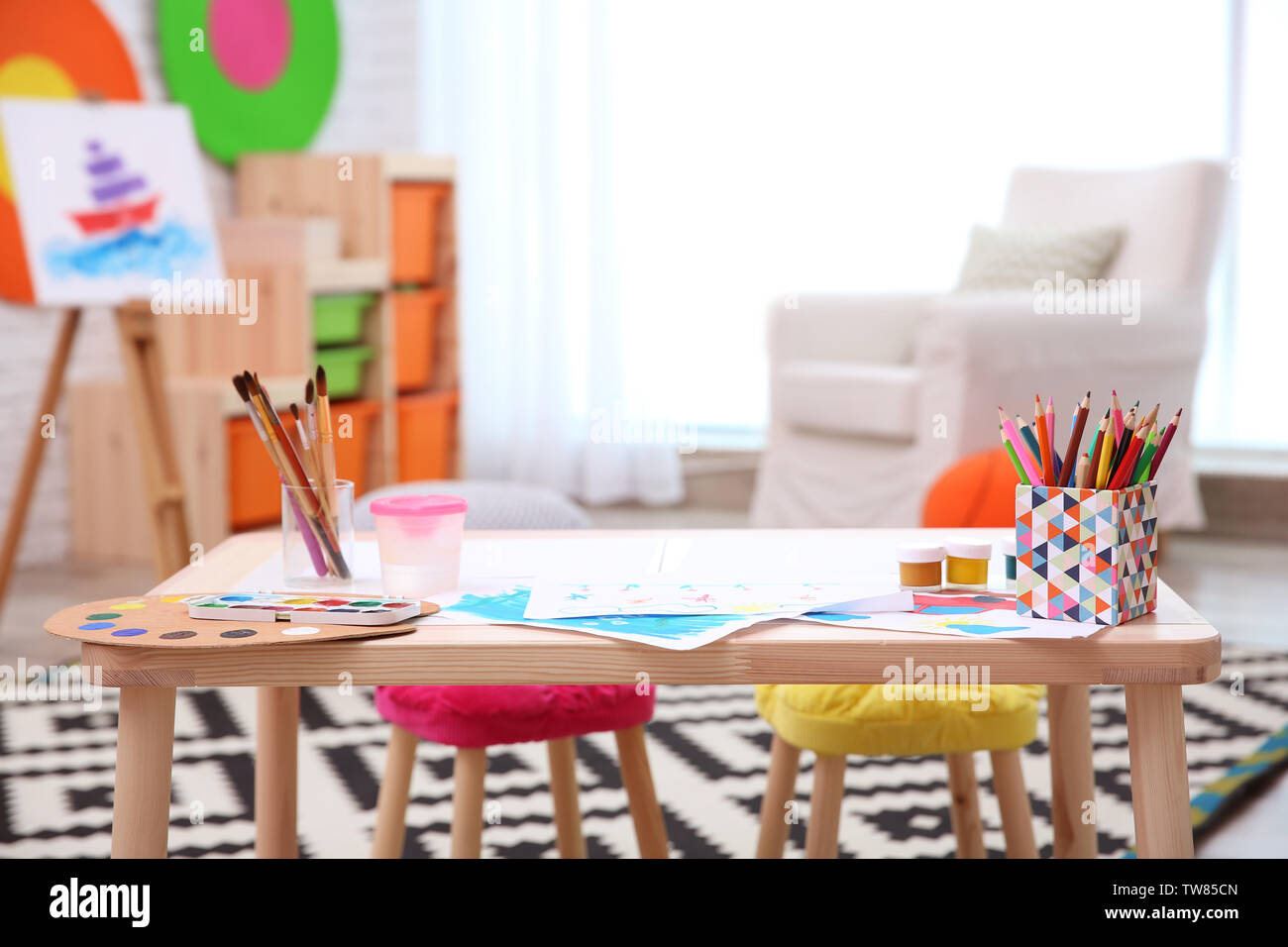 Child's room with table for drawing Stock Photo - Alamy