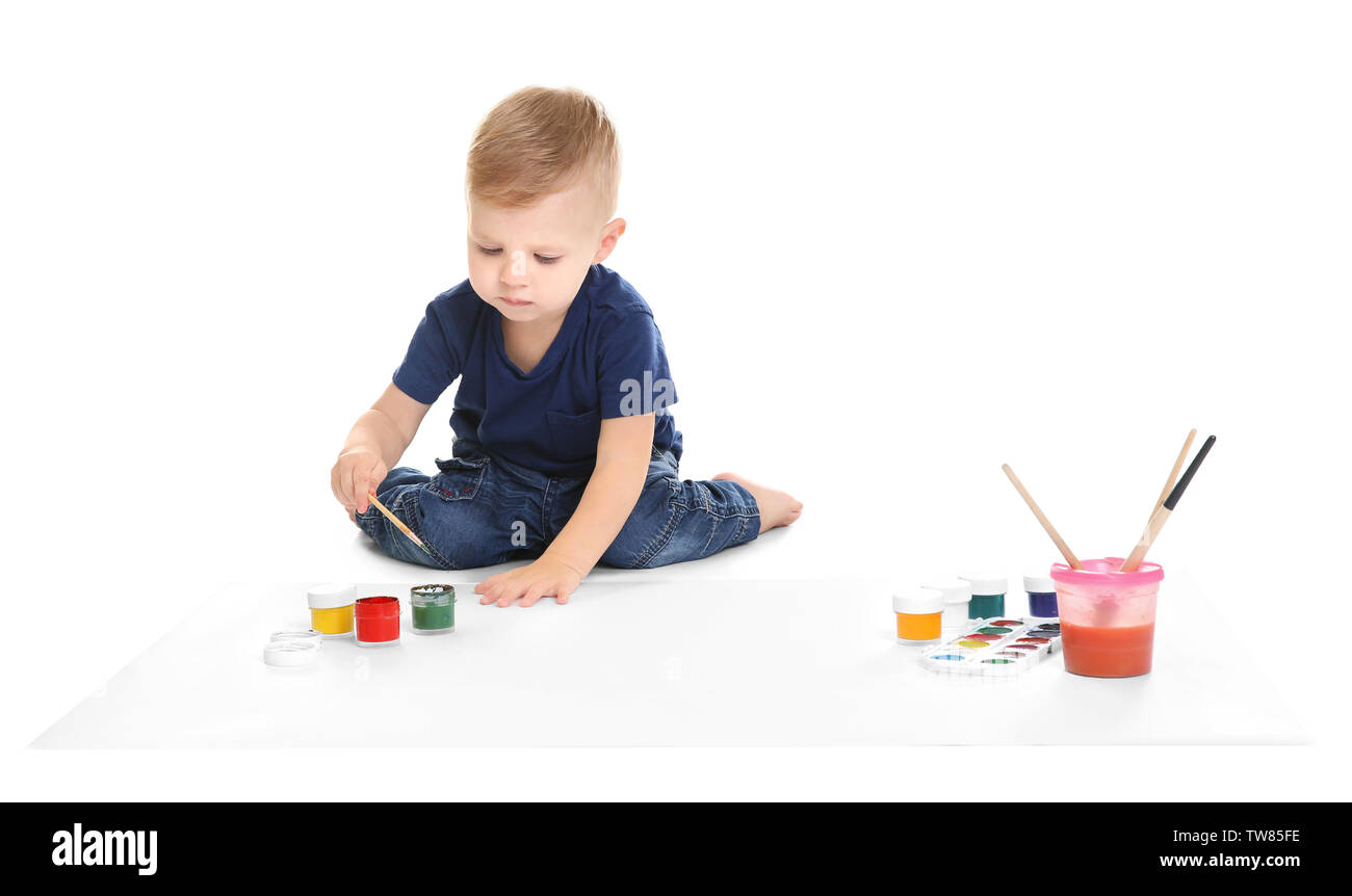 Little Boy Painting On Big Sheet Of Paper Isolated On White Stock Little boy painting on big sheet of paper isolated on white stock