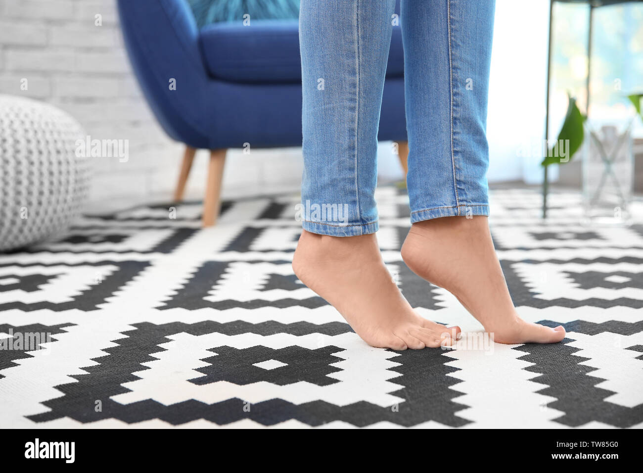 Person standing rug barefoot hi-res stock photography and images - Alamy