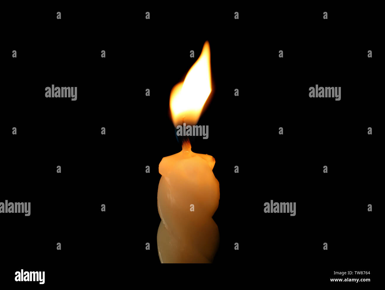 Spiral candle burning in darkness, closeup Stock Photo Alamy