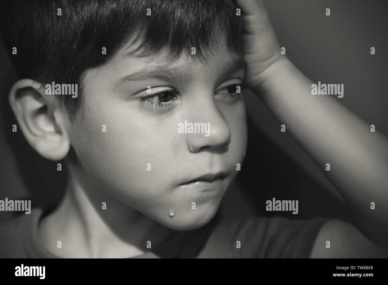 Little sad boy crying. Abuse of children concept Stock Photo - Alamy