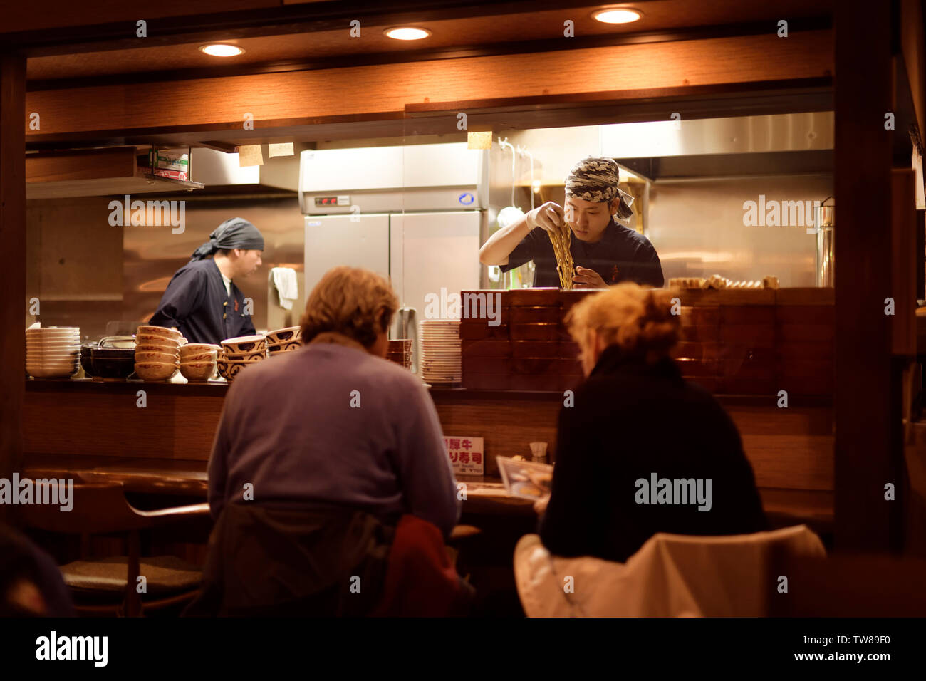 Chefs working in a Japanese soba ramen noodle restaurant in Takayama, Gifu prefecture, Japan. Stock Photo