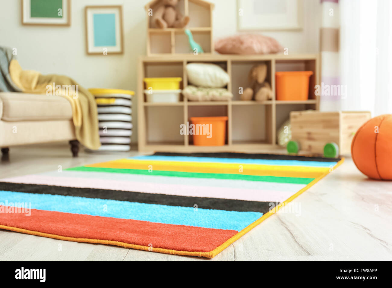 Interior of child's room with colorful carpet Stock Photo Alamy