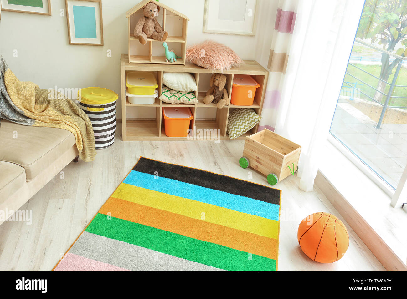 Interior of child's room with colorful carpet Stock Photo Alamy