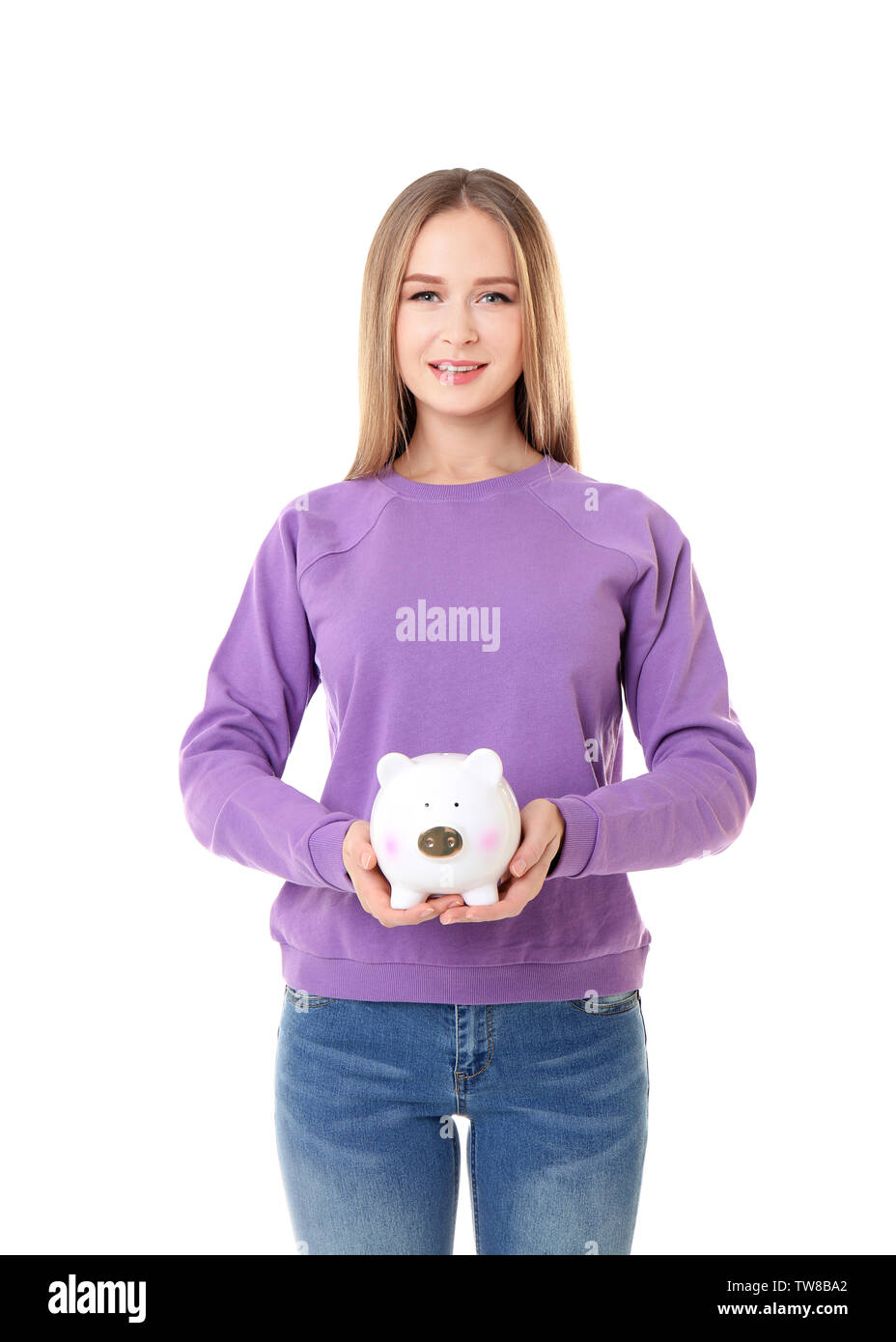 Young woman holding piggy bank on white background Stock Photo - Alamy