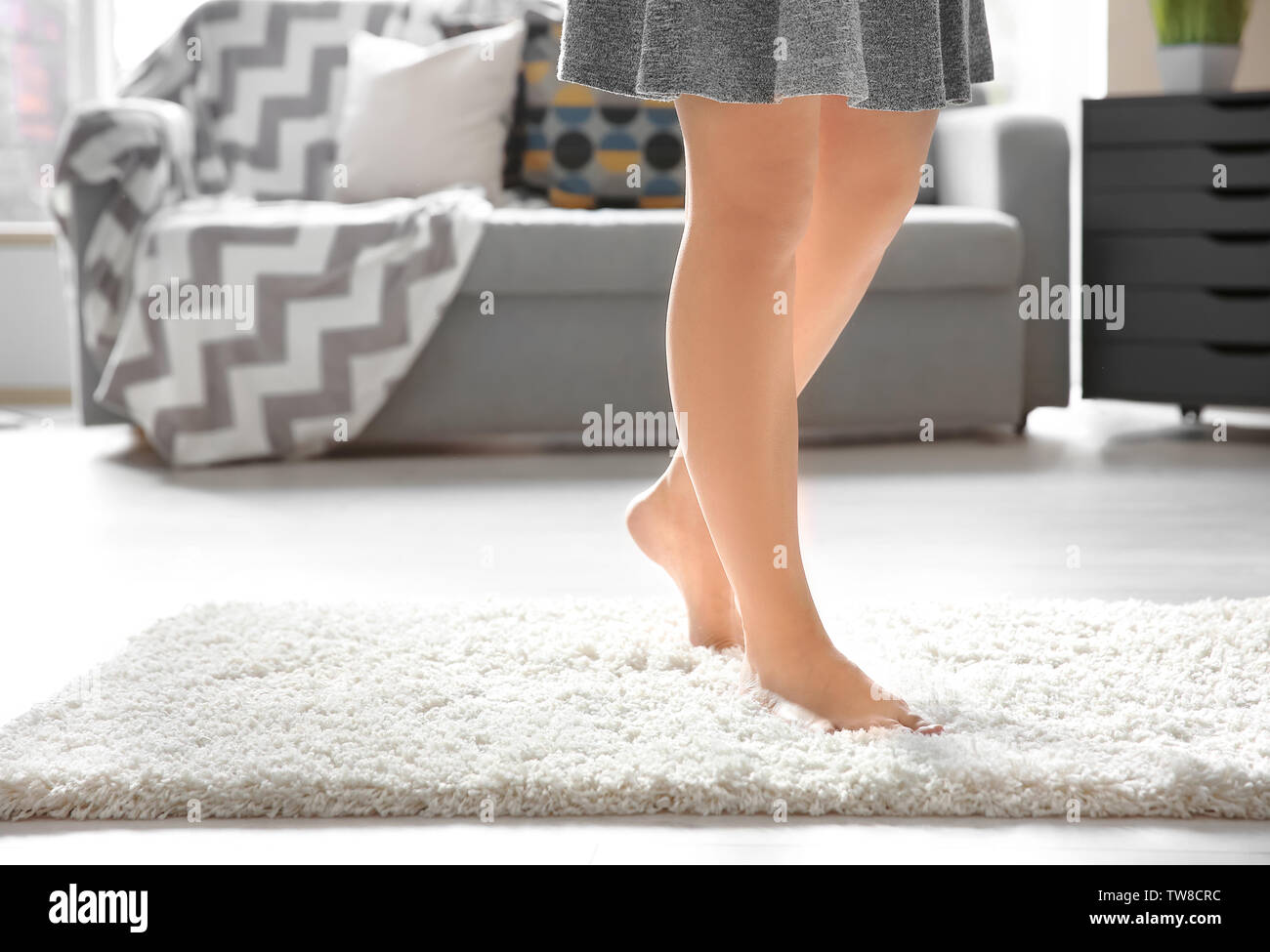 Walk On Rug Legs of young woman walking on soft carpet at home Stock Photo - Alamy