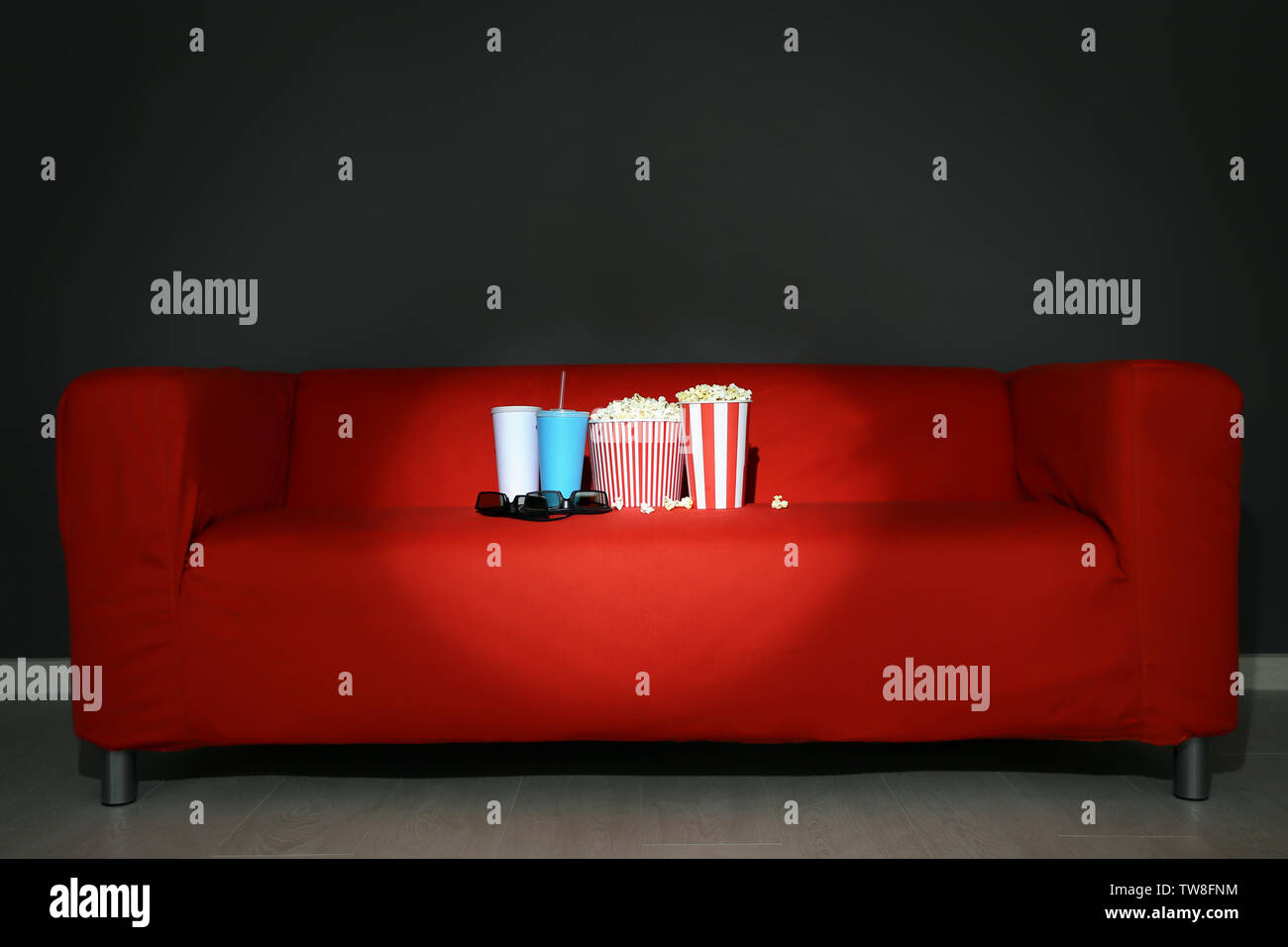 Comfortable Sofa In Home Cinema Movie Night Stock Photo