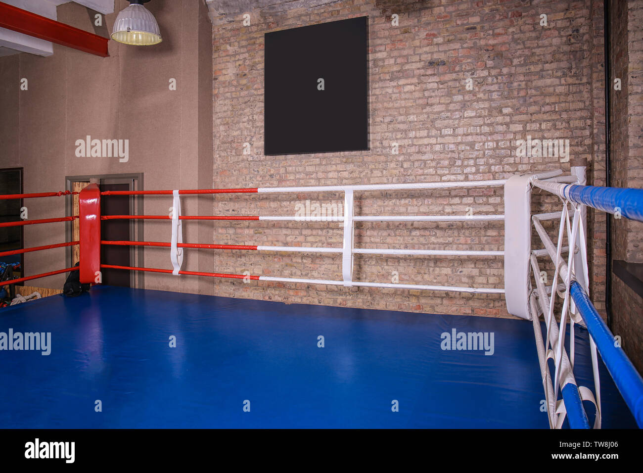View of empty boxing ring in gym Stock Photo
