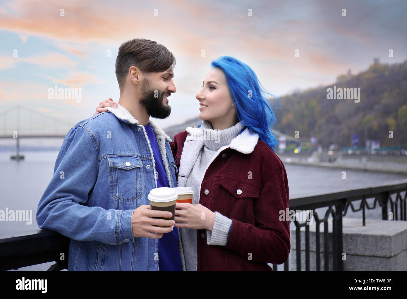 Young hipster couple on date outdoors Stock Photo Alamy