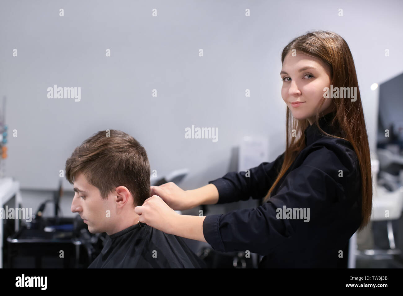 Female hairdresser with client in salon Stock Photo - Alamy