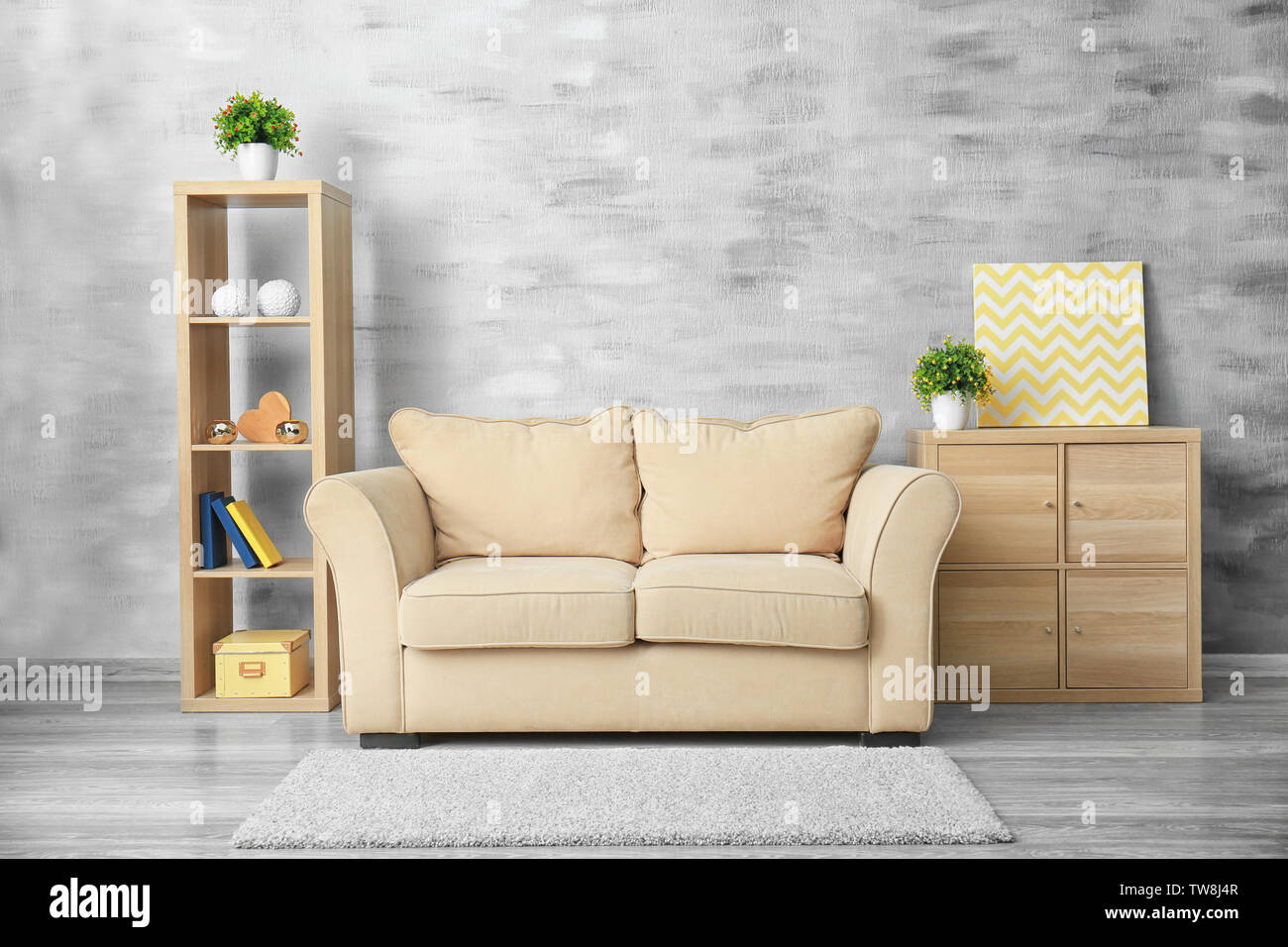 Cozy living room interior with beige sofa Stock Photo - Alamy