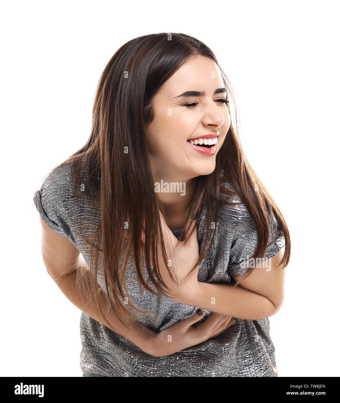 Attractive young woman laughing on white background Stock Photo - Alamy