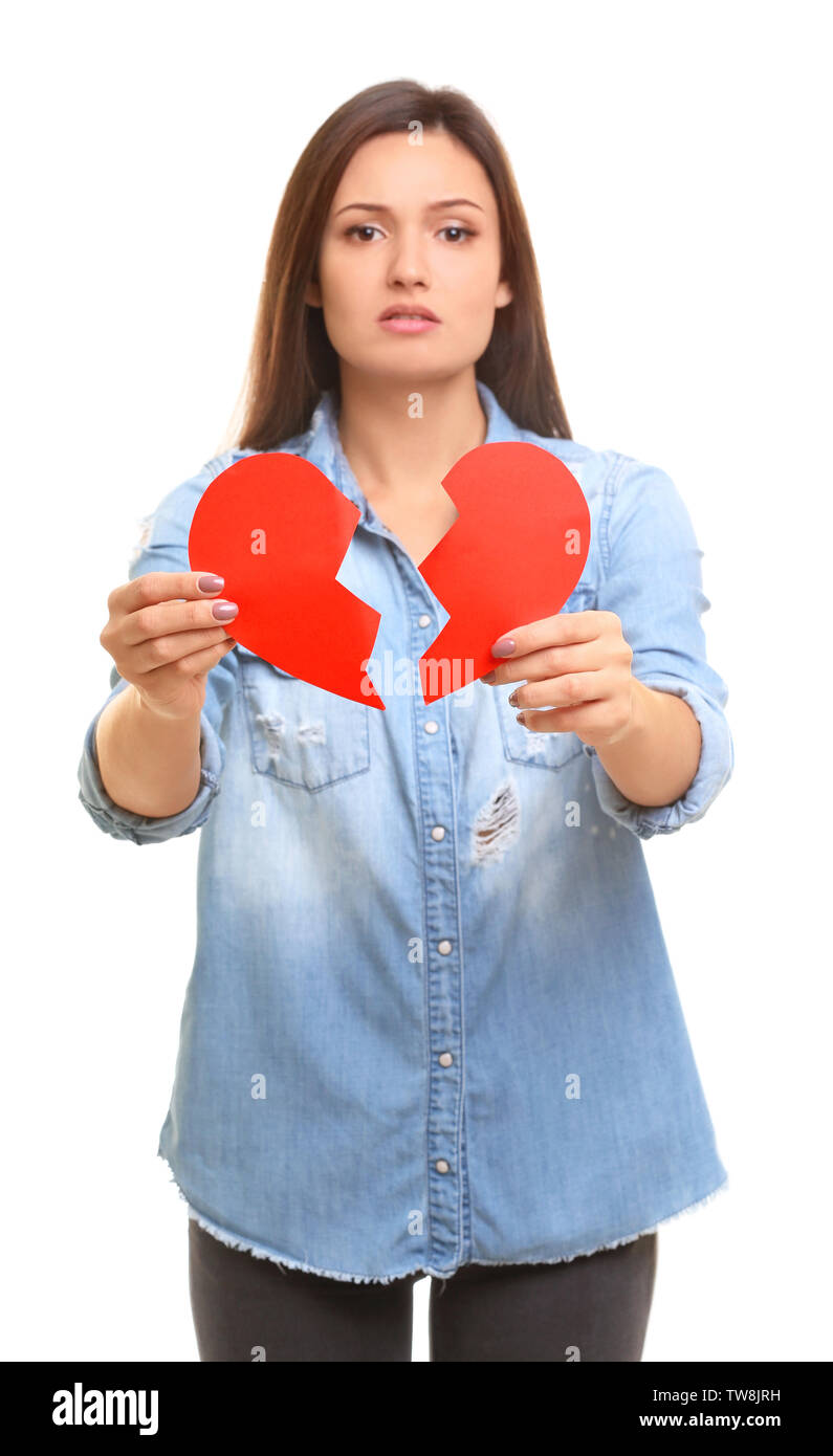 Young woman holding torn paper heart on white background Stock Photo ...