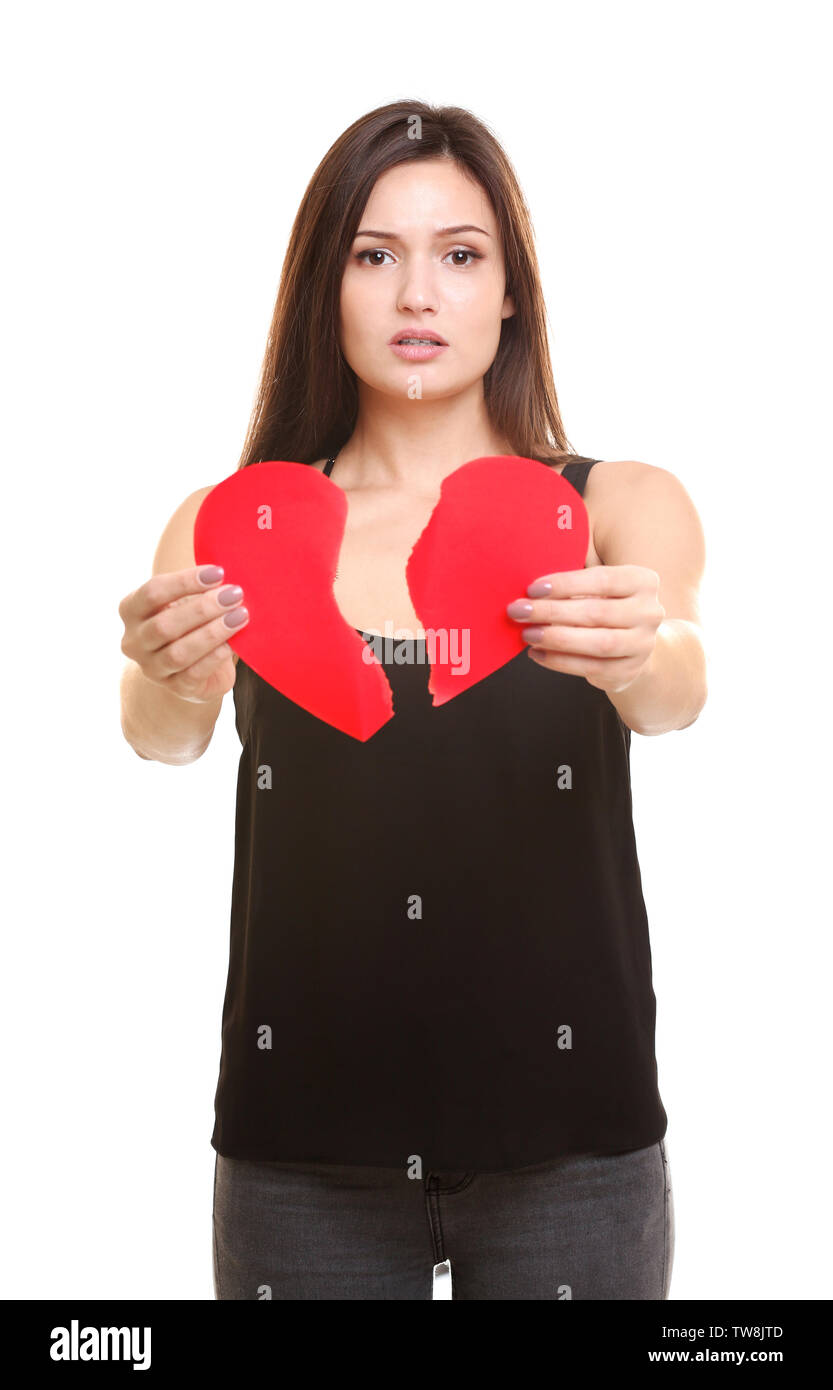 Young woman holding torn paper heart on white background Stock Photo ...