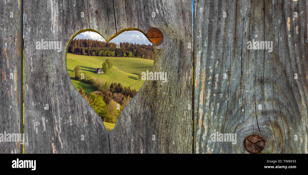 looking through a heart shape in the landscape Stock Photo