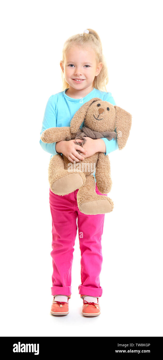 Cute little girl holding toy on white background Stock Photo Alamy