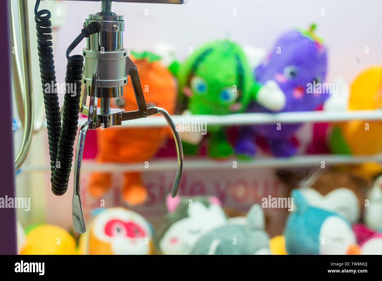 Mall clip doll machine Stock Photo - Alamy