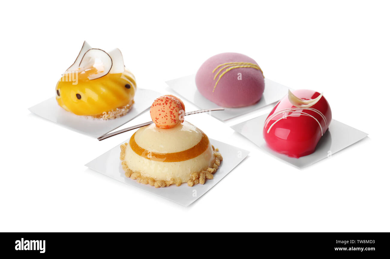 Various tasty cakes on white background Stock Photo