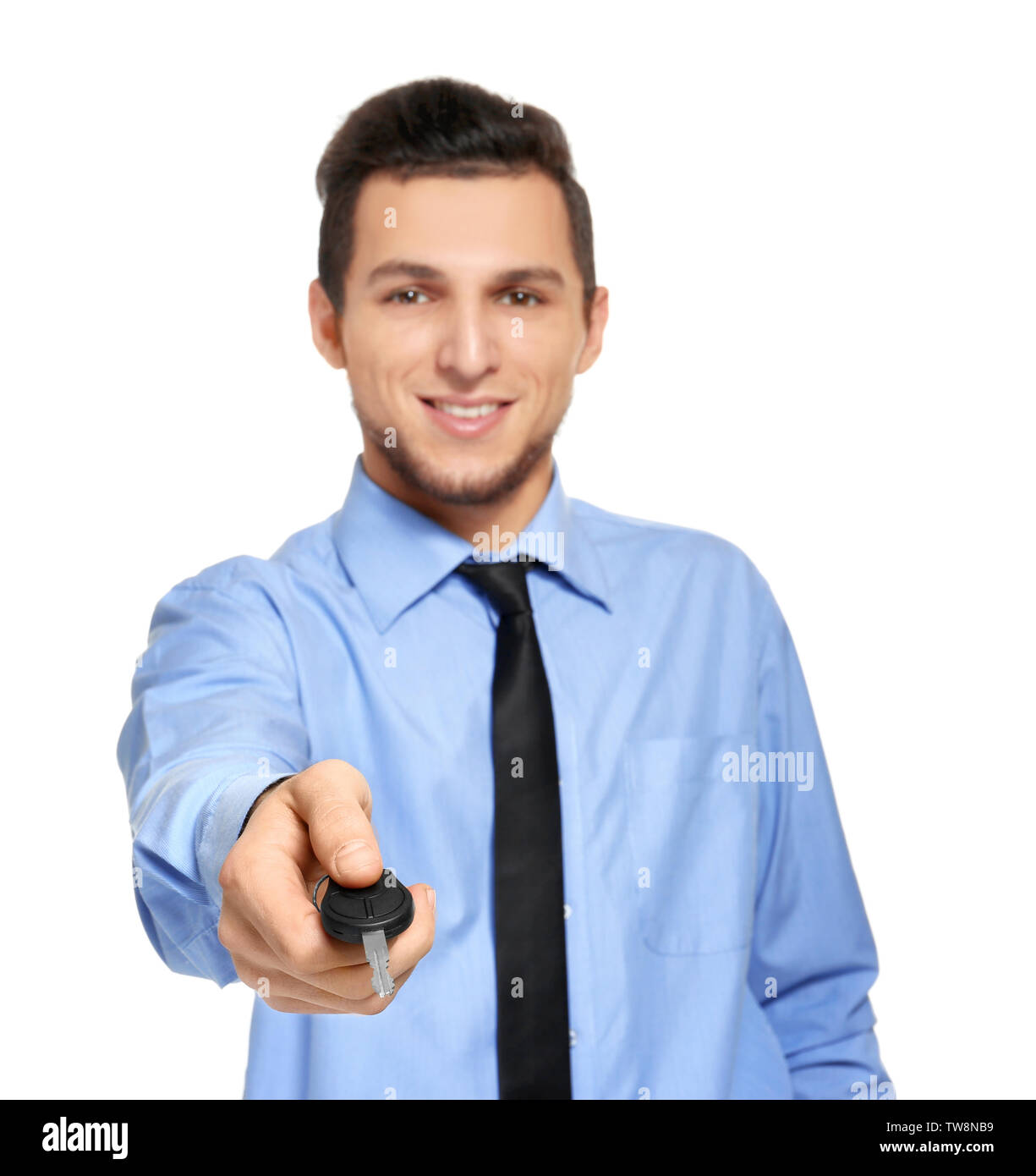 Man in office wear holding car key on white background Stock Photo - Alamy