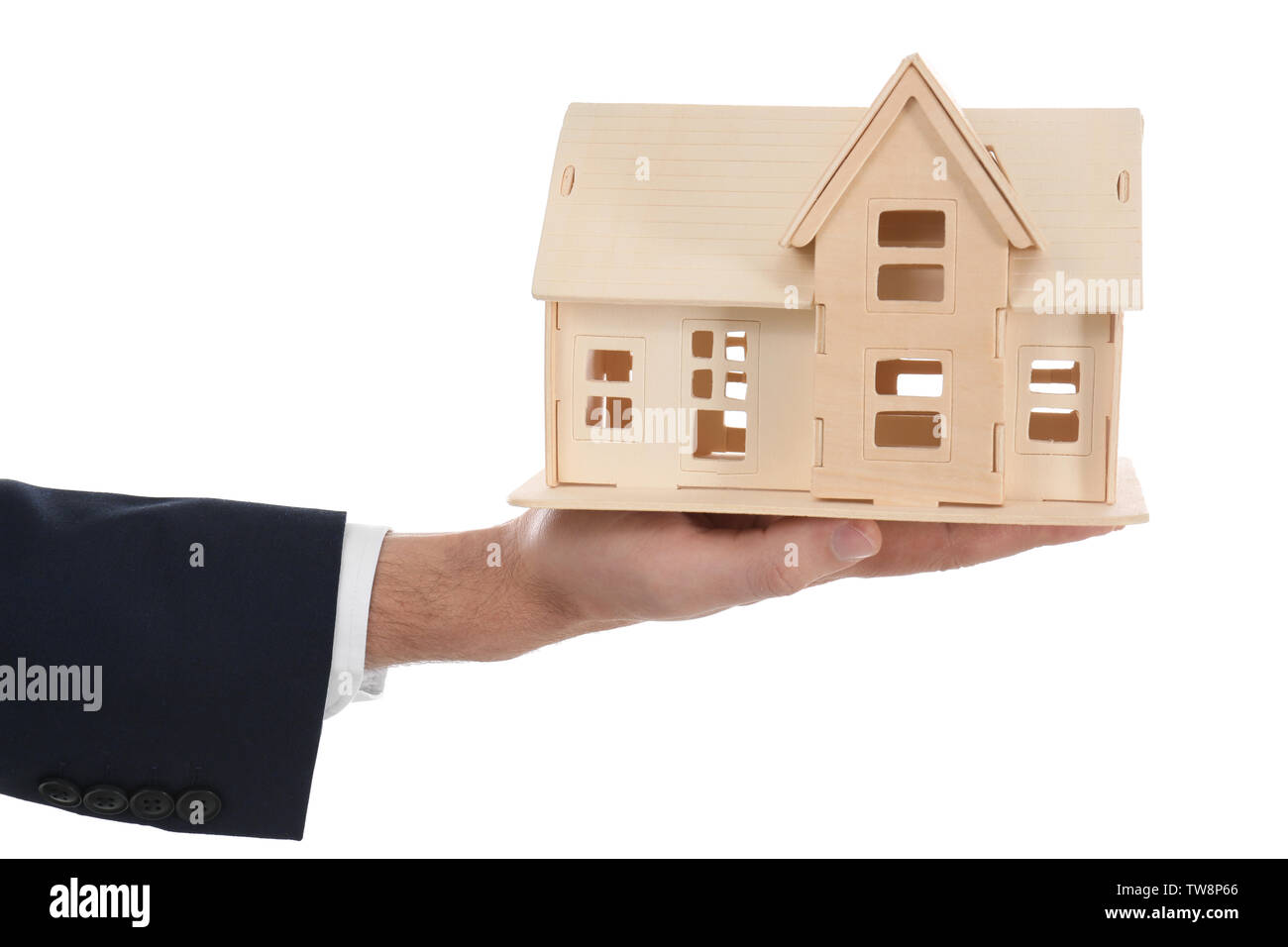 Real estate agent holding house model on white background Stock Photo ...