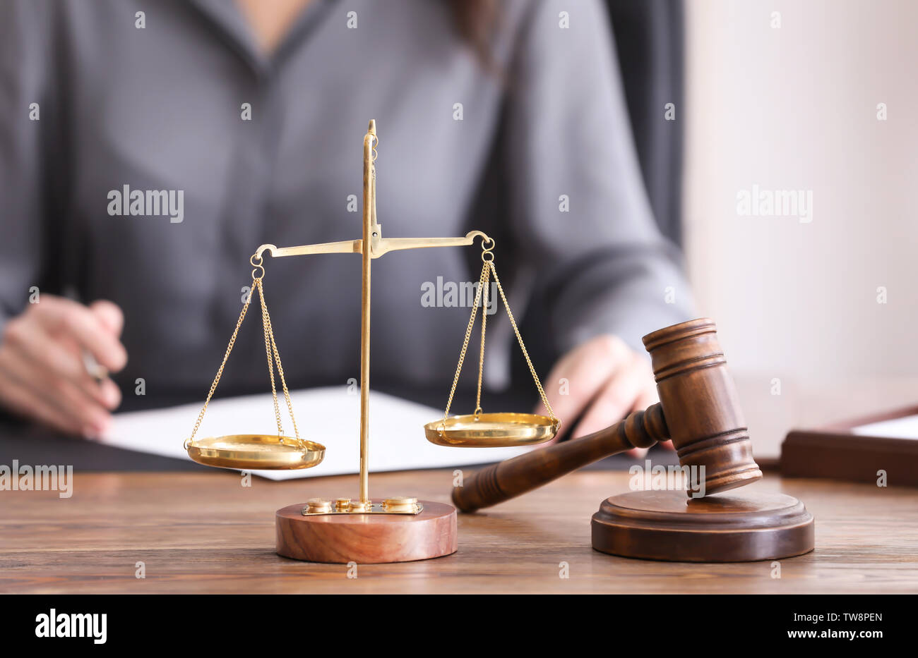 Scales of justice and judge hammer on table in notary's office Stock ...