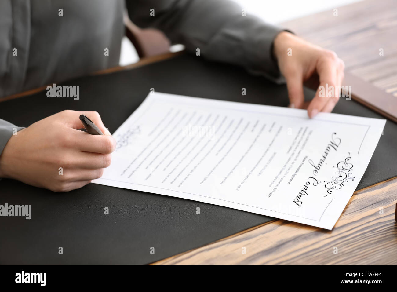 Female notary signing marriage contract, closeup Stock Photo Alamy