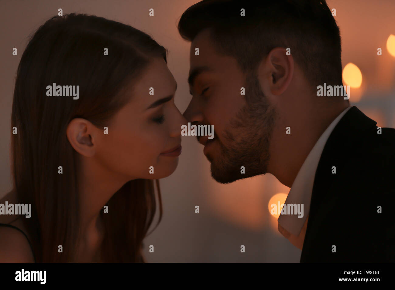 Young couple kissing on romantic date Stock Photo - Alamy