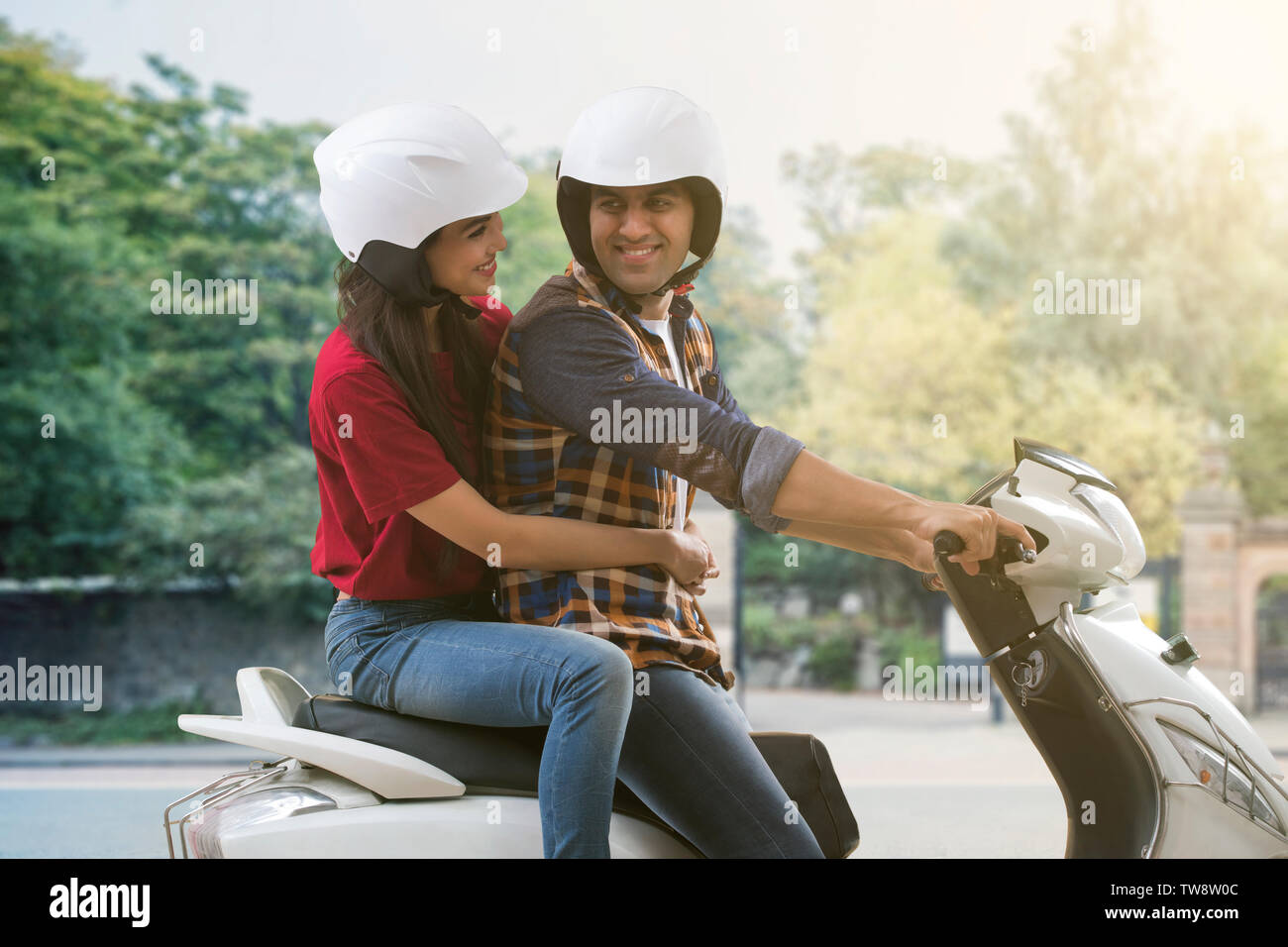 Two people riding a motorbike hi-res stock photography and images - Alamy