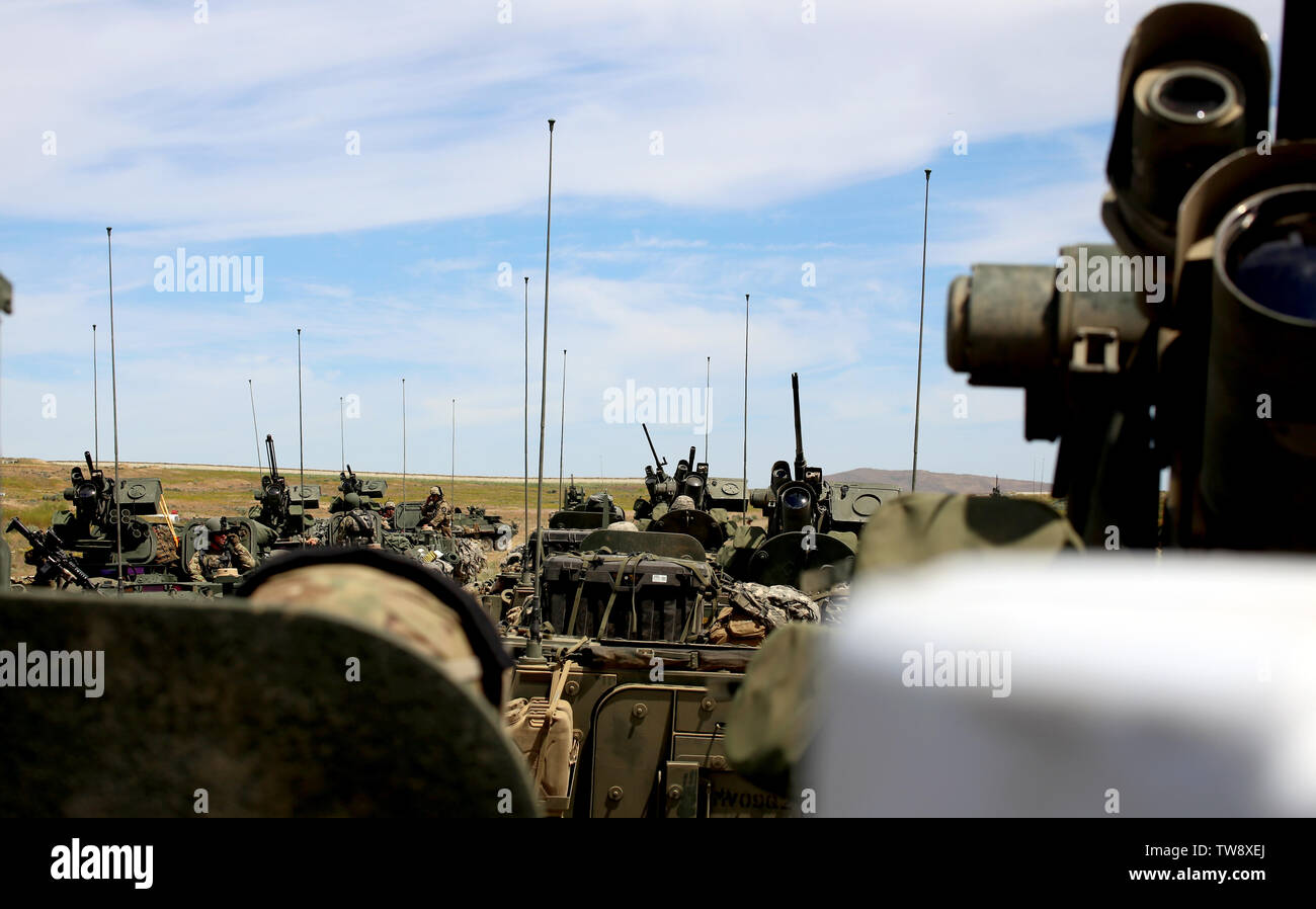 Strykers from 3rd Battalion, 161st Infantry Regiment, wait for their turn to participate in a platoon live fire exercise at Yakima Training Center. The 3-161 Infantry are participating in Bayonet Focus as a lead up to an NTC rotation next year. Stock Photo