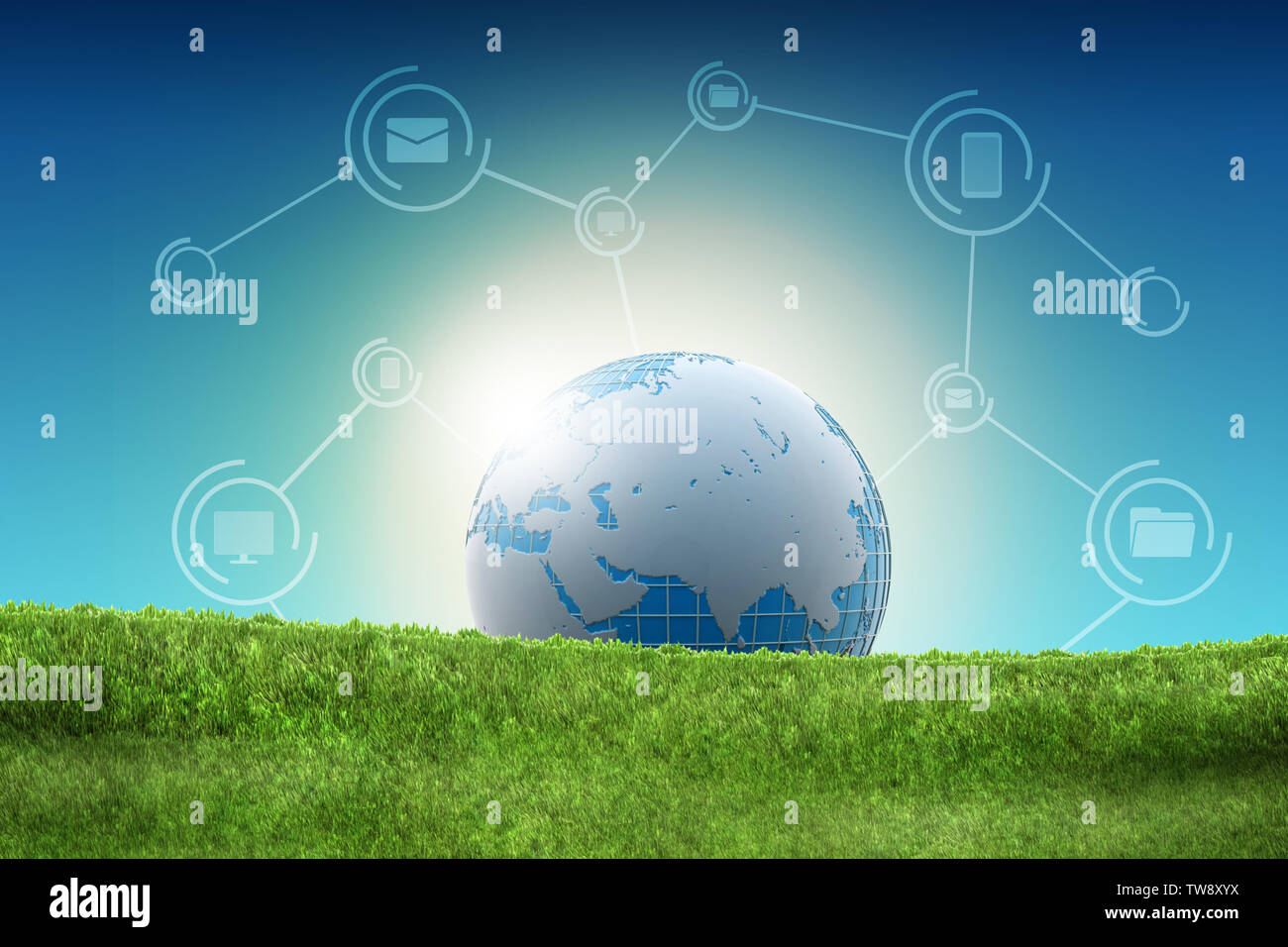 Globe lying on the green grass Stock Photo - Alamy