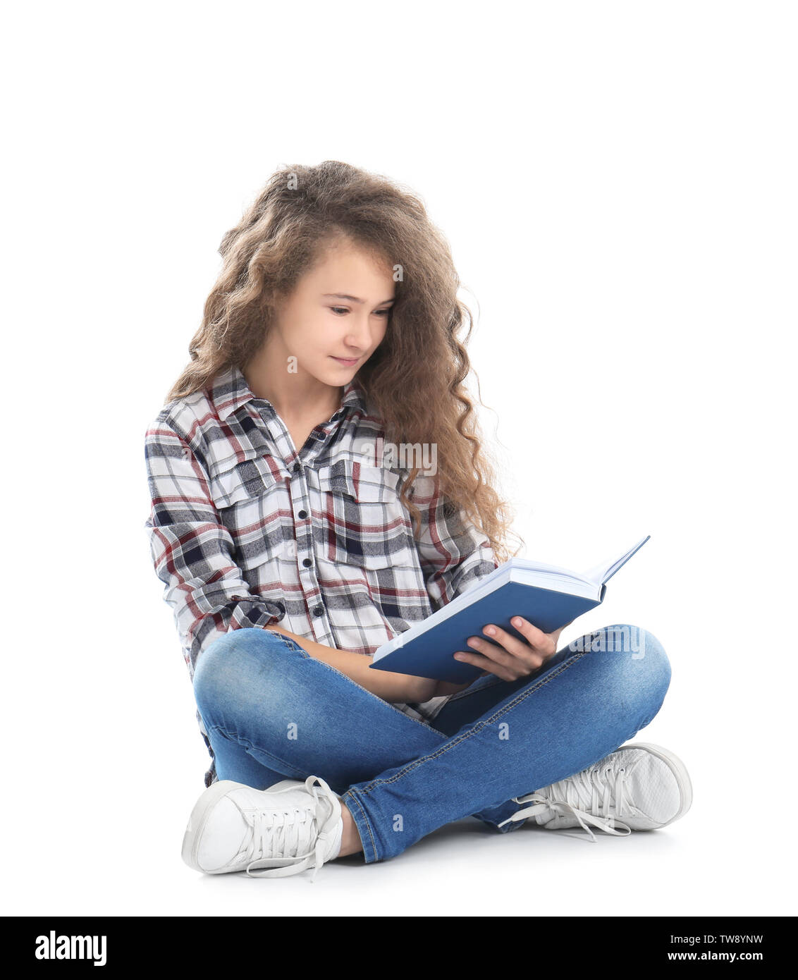 Stylish teenager reading book on white background Stock Photo - Alamy