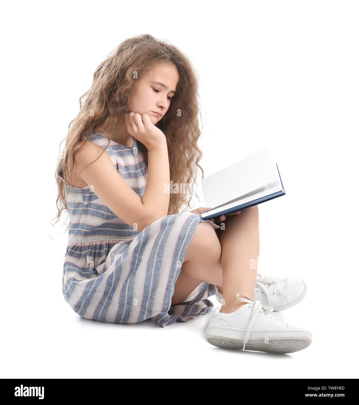 Stylish teenager reading book against white background Stock Photo - Alamy