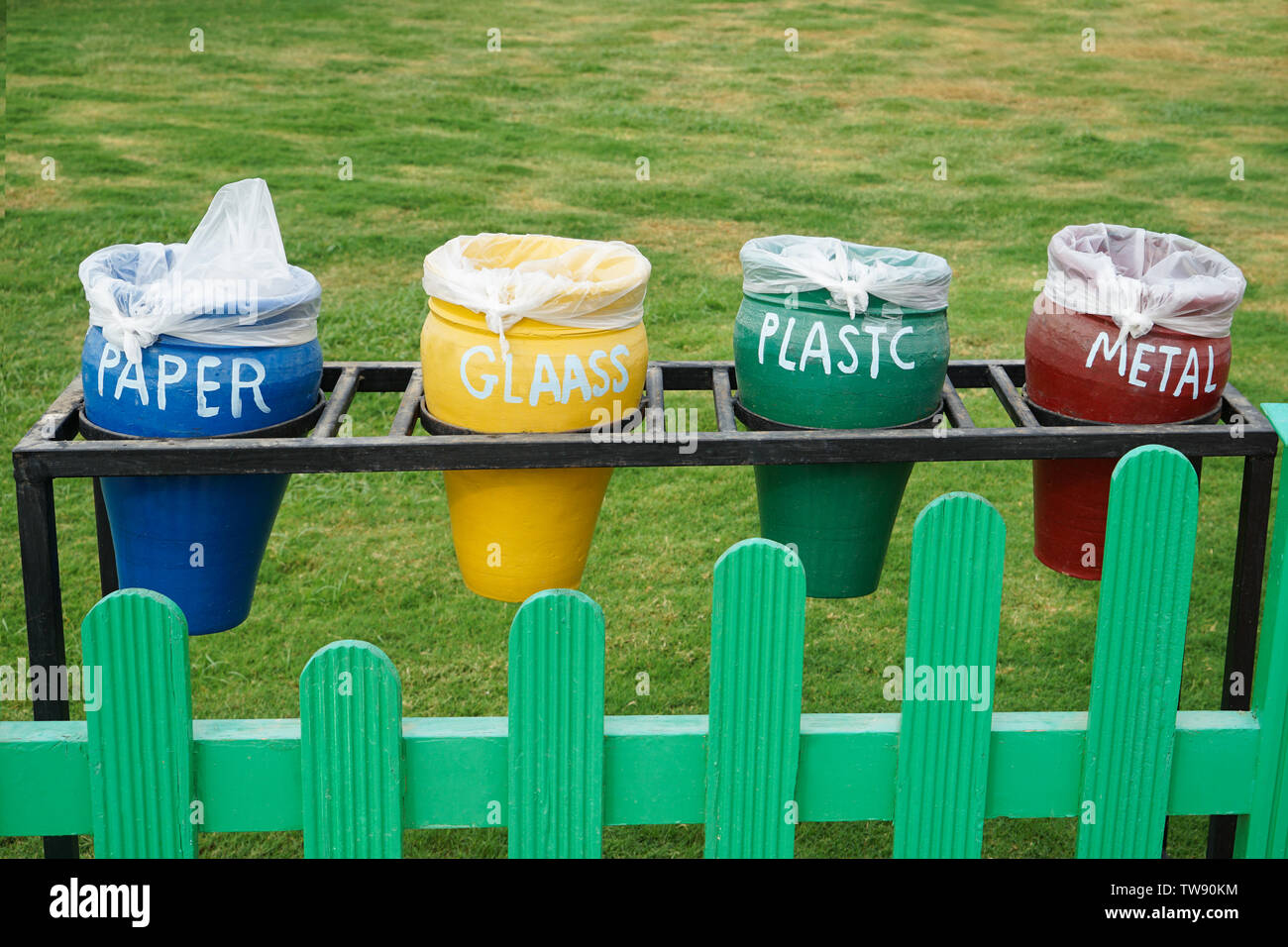 Different colorful trash bins outdoors. Recycling concept Stock Photo