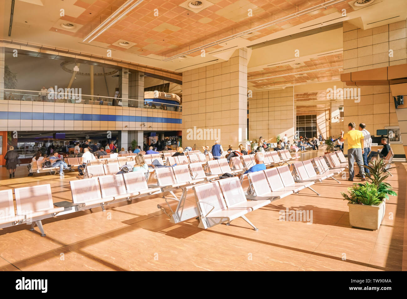 Airport waiting room people sitting hi-res stock photography and images ...