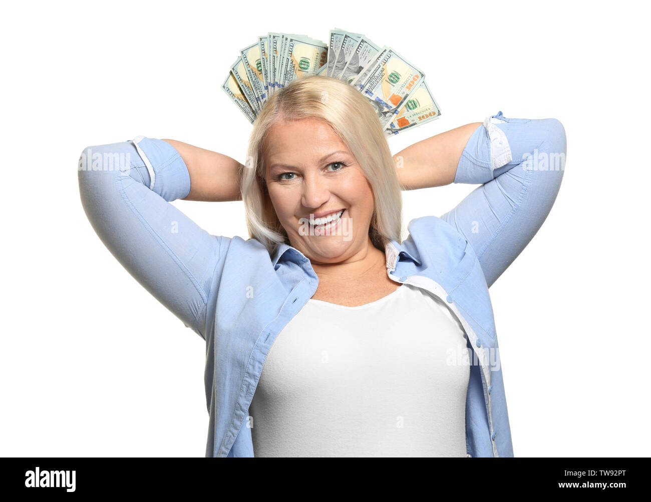 Happy mature woman with lot of dollar banknotes on white background ...