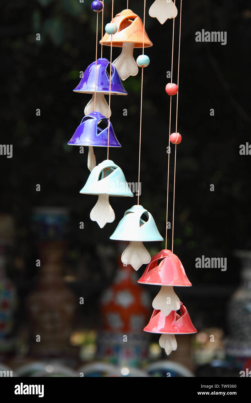 Wind chimes at a market stall, India Stock Photo
