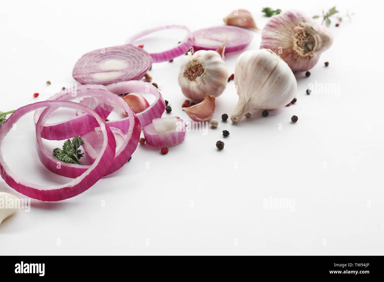 Fresh garlic, onion and pepper grains on white background Stock Photo ...
