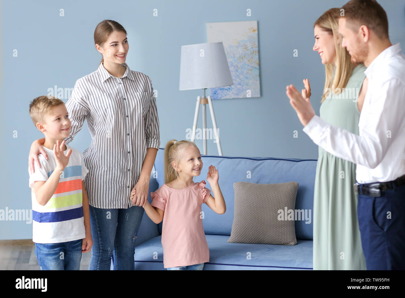 parents-leaving-their-children-with-nanny-at-home-stock-photo-alamy