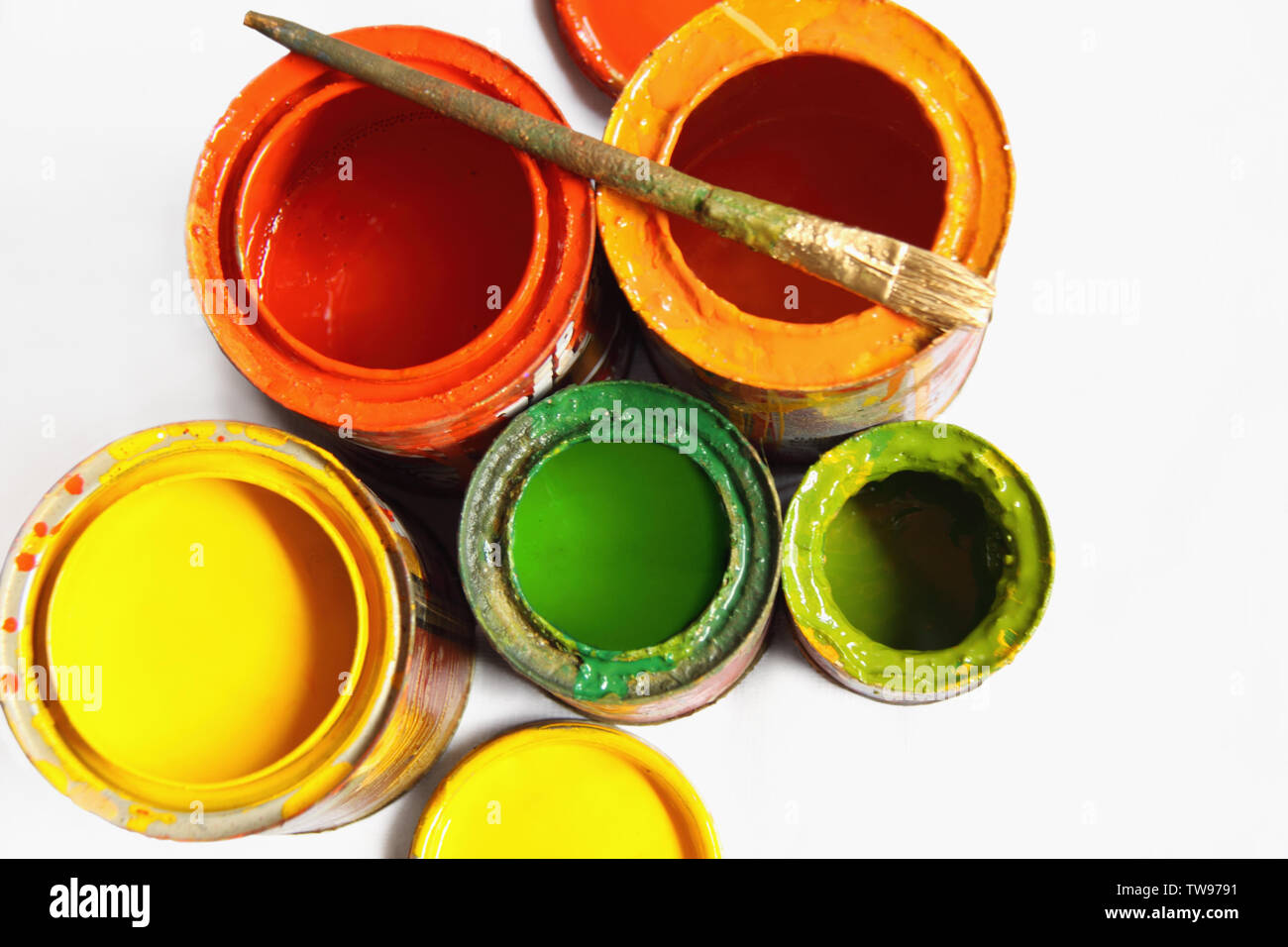 High angle view of open paint cans and a paintbrush Stock Photo