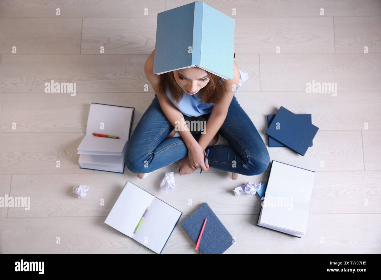 Female student preparing for exam indoors Stock Photo